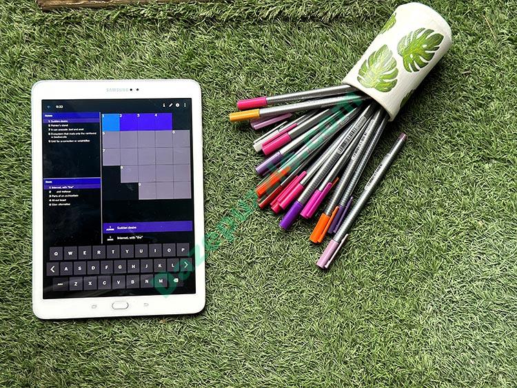 NYT mini crossword dark theme tablet grass